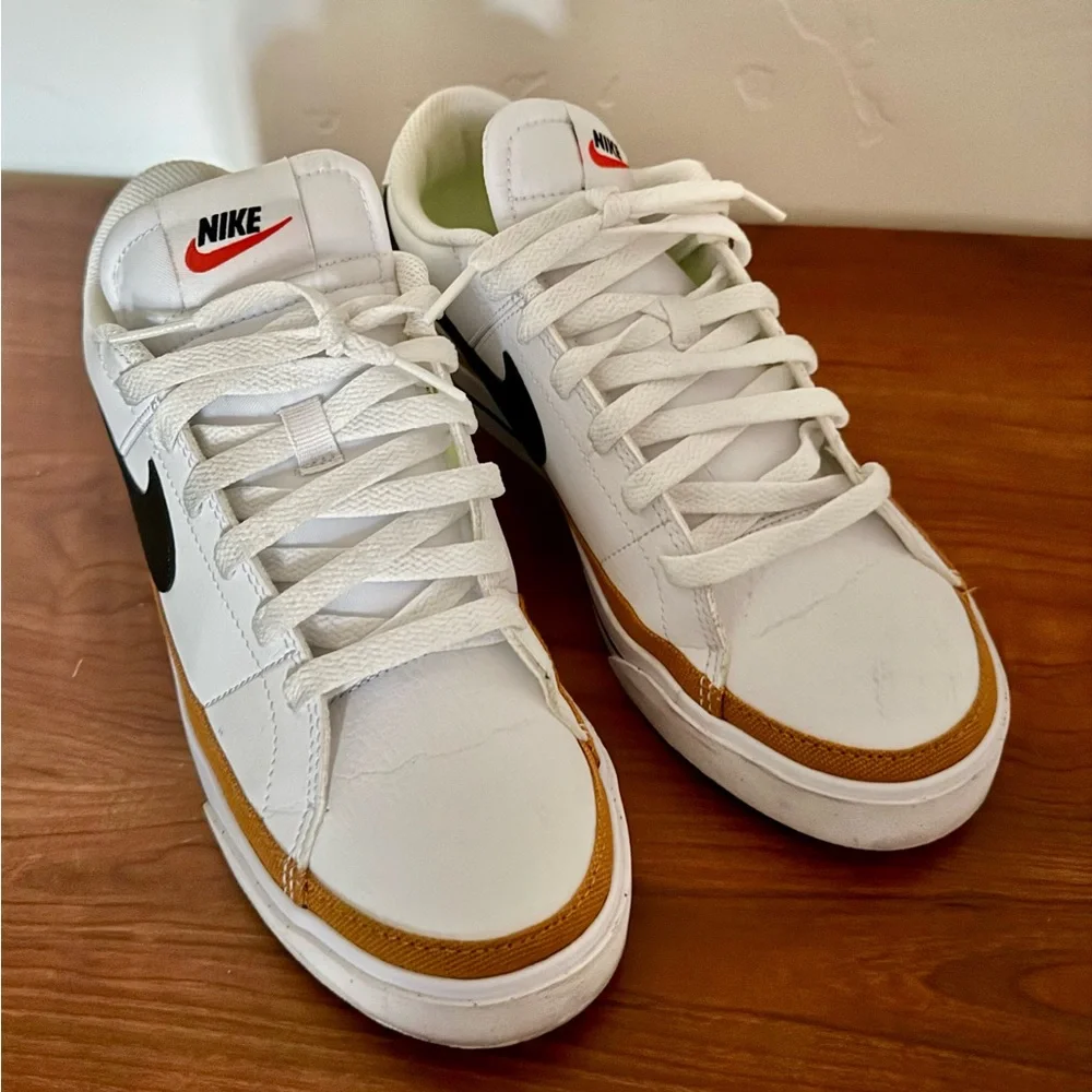 Nike White Sneakers with Black Swoosh and Gold Accent - Picture 5 of 7
